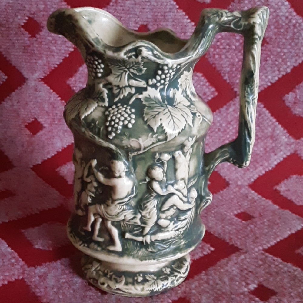 Antique Gothic Pitcher with Embossed Figures